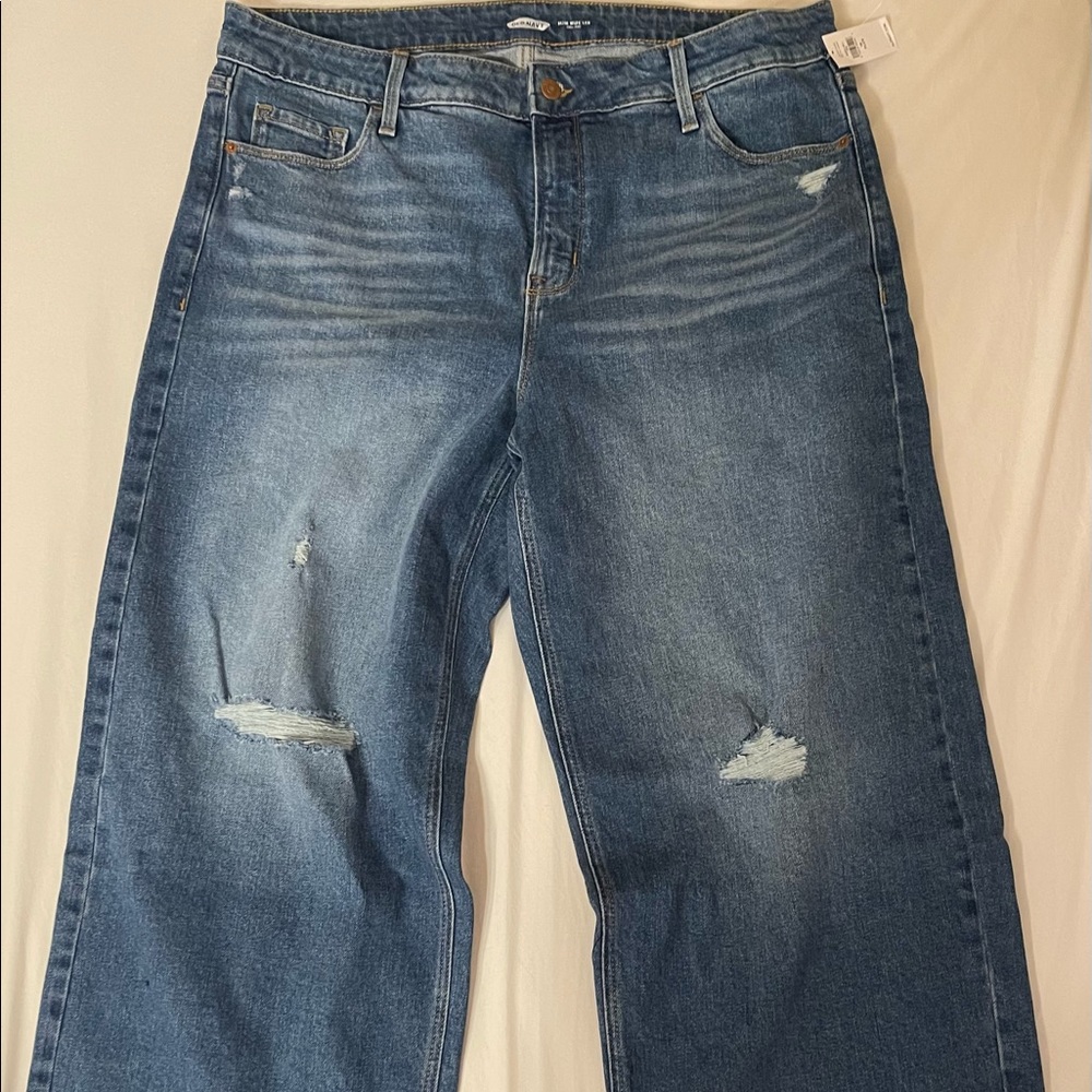 NWT distressed high rise, slim cut wide leg jeans. Medium rinse denim.